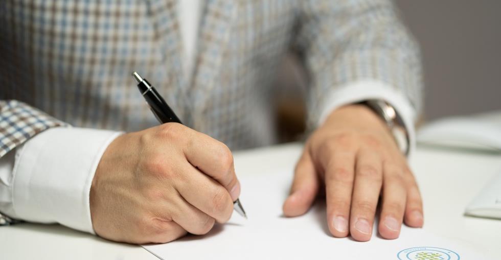 Person signing a contract