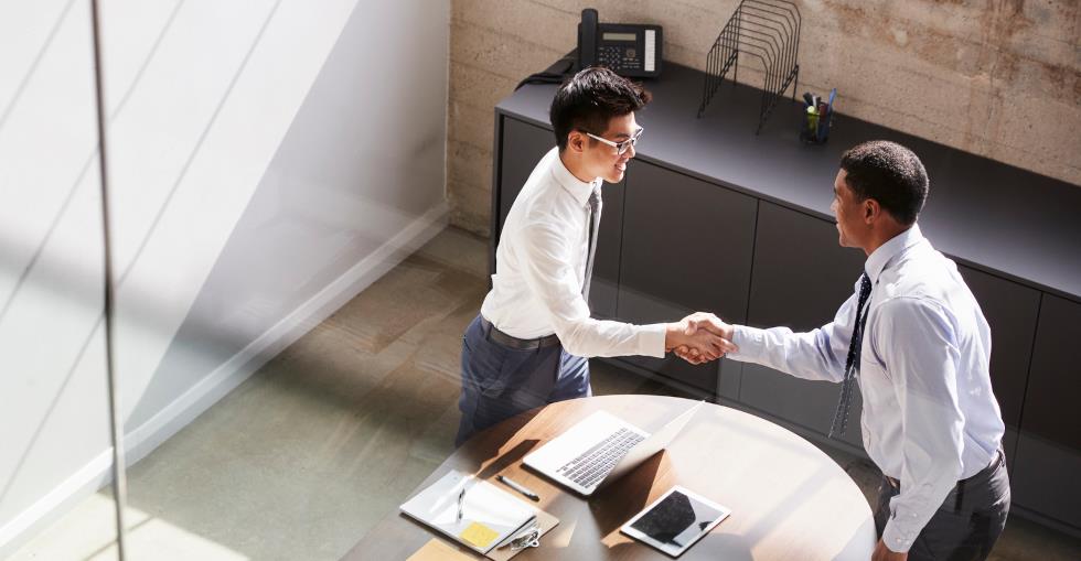 Two business men shaking hands