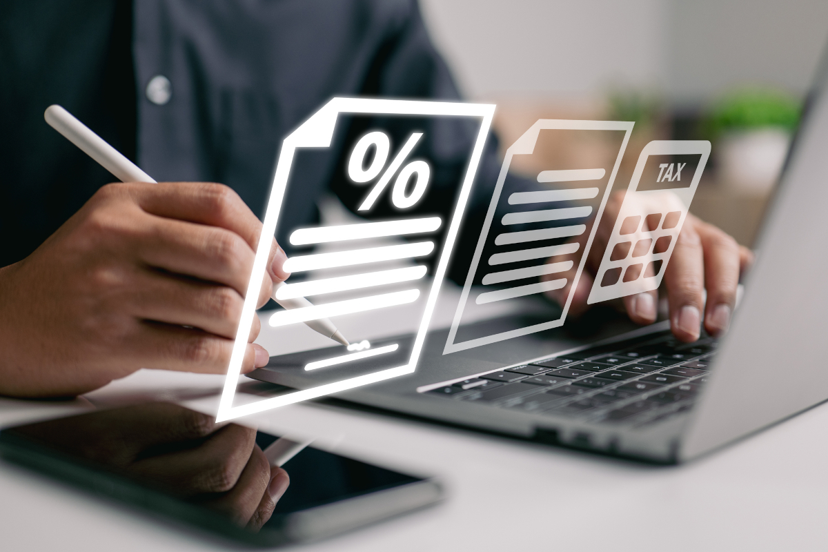 Person calculating tax and percentage