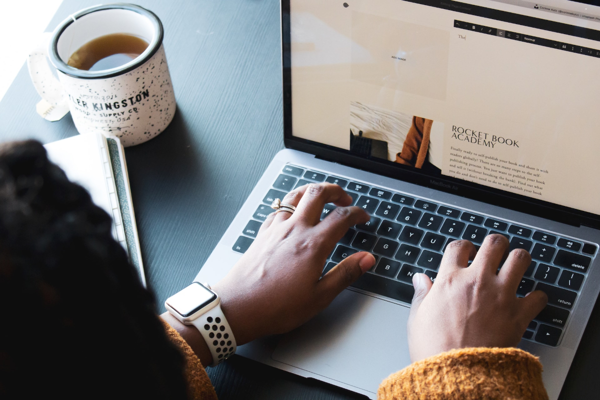 Women typing on a laptop