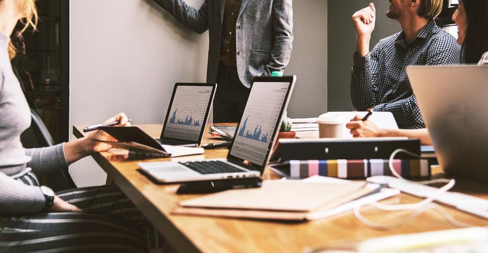 Group of business people discussing documents and data