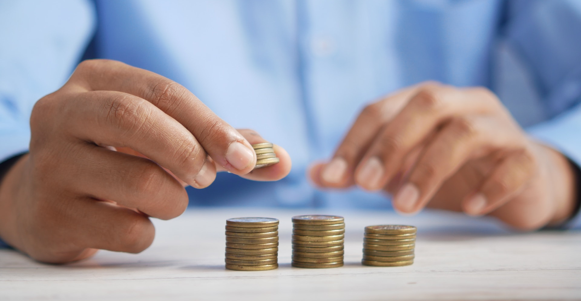 man counting coins