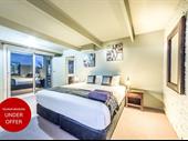 by motel room one